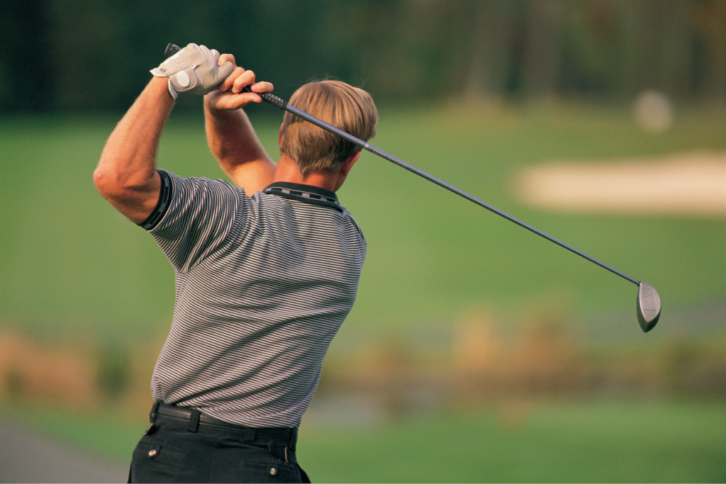 The Sunday Golf_Hip rotation drill golf swing alignment_Golfer practicing swing at driving range